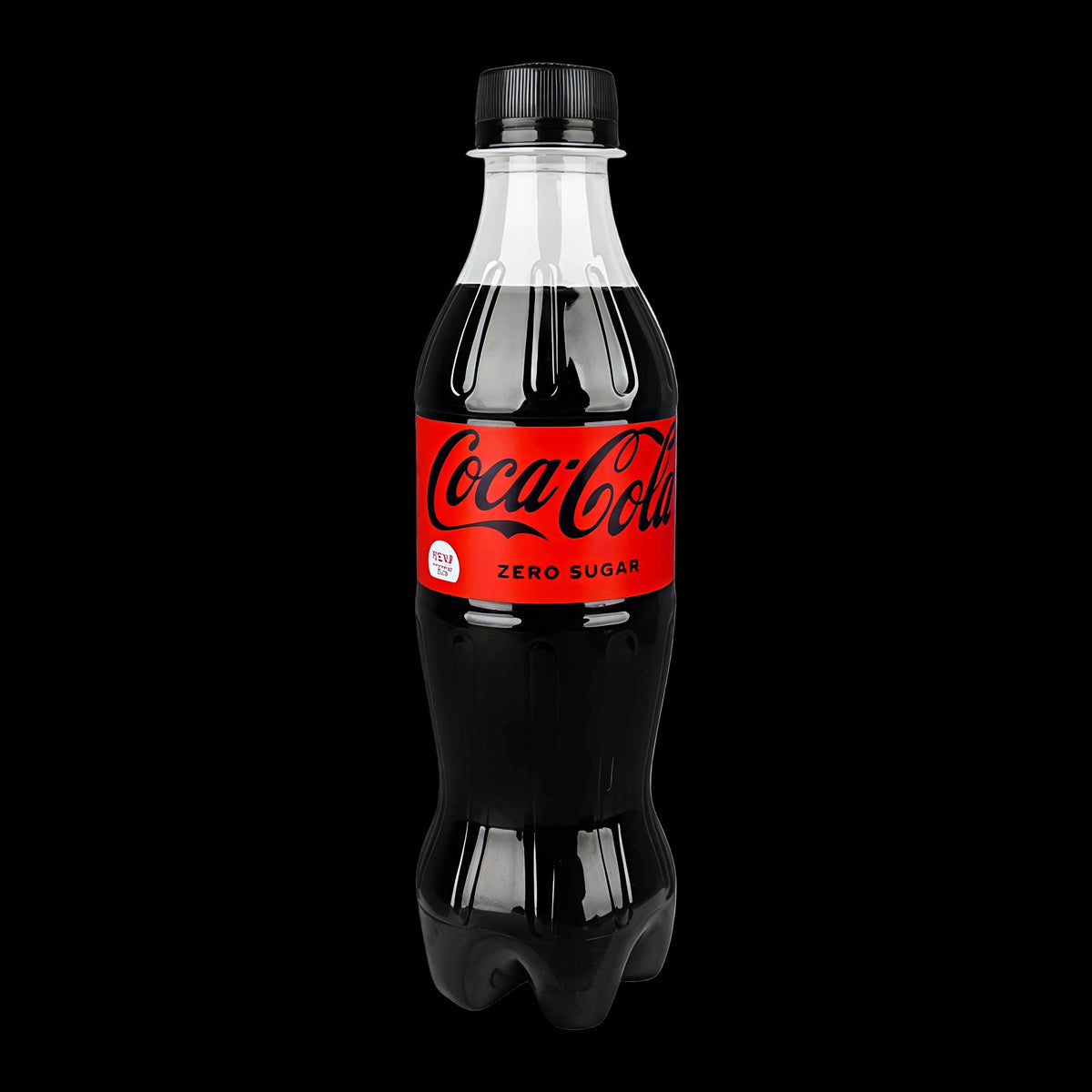 A 345ml plastic bottle of Coca-Cola Zero Sugar, showing the iconic red label with white script and black text, filled with dark cola and topped with a black cap, isolated on a white background.